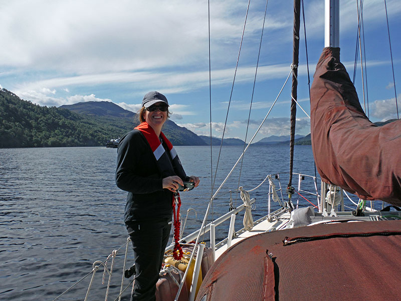 Heather on the foredeck while Toucan motors down Loch Ness