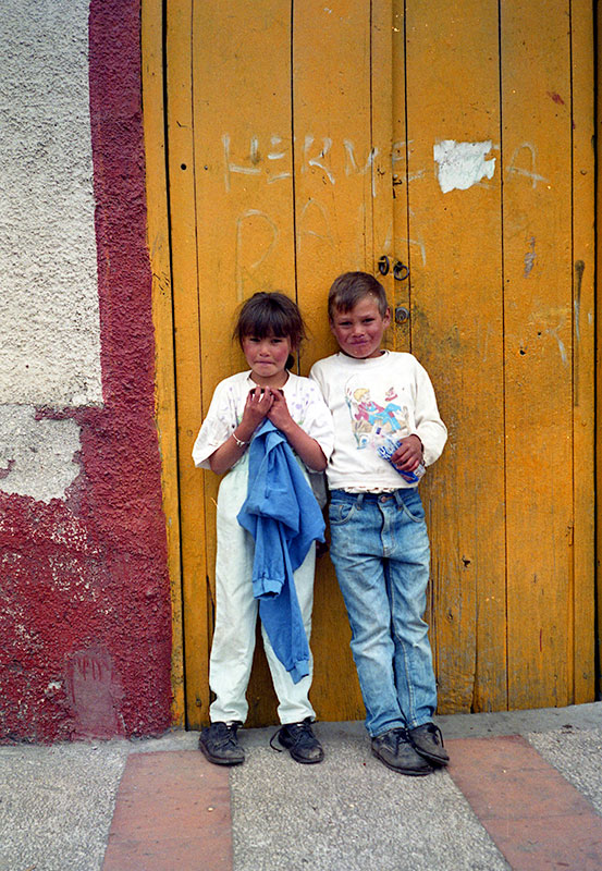 Every child had red cheeks. These two posed against a colourful door.