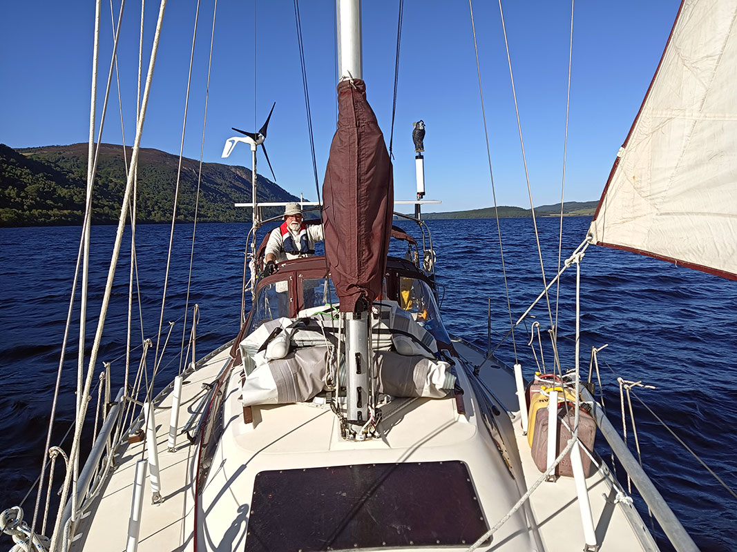 Toucan sailing on Loch Ness. Beautiful sunny day and hull speed with just the Genoa