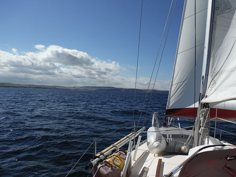 Toucan sailing along the Moray Firth coastline