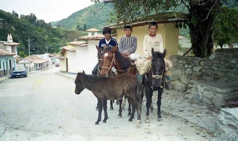 Children on horseback, a common sight in the village.