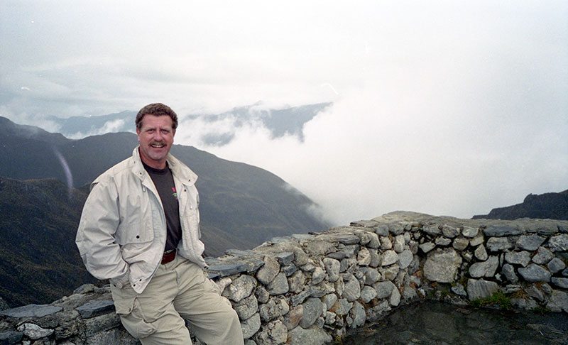 Willie at a lookout point, with the clouds far below.