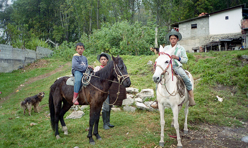 Children learn to ride horses at an early age in the mountains.